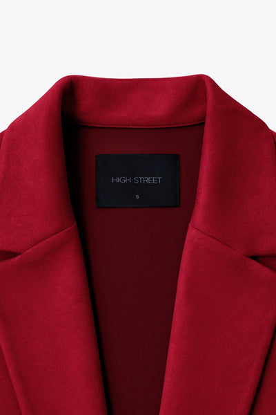 Abrigo abierto de gamuza, fit recto, con solapa, manga larga y bolsillos delanteros ocultos.