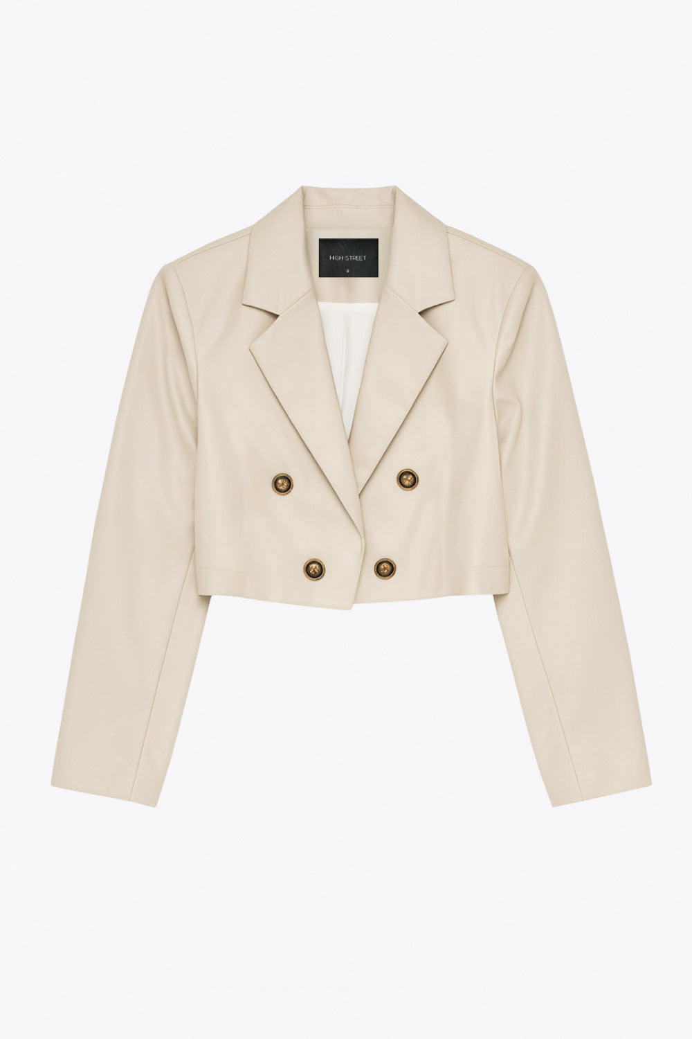 Blazer corto abierto de efecto piel, fit recto, con hombreras y solapa, manga larga y botones decorativos frontales en contraste.