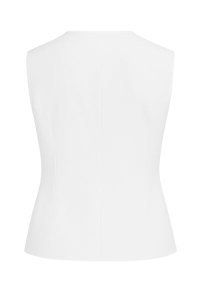 Blusa de fit ajustado, cuello redondo, sin mangas y cierre frontal con lazos amarrables. Detalle de bajo curveado frontal.