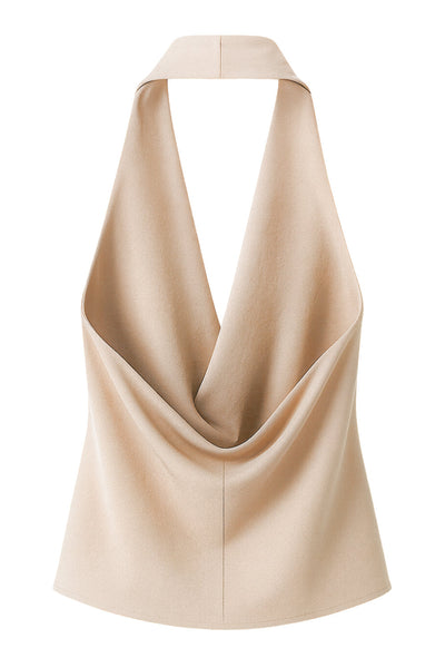 Blusa de cuello halter, escote fluido frontal, sin mangas y escote en espalda.