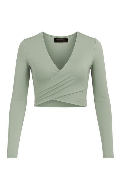 Crop top de escote v cruzado con plisados frontales, manga larga y fit ajustado.