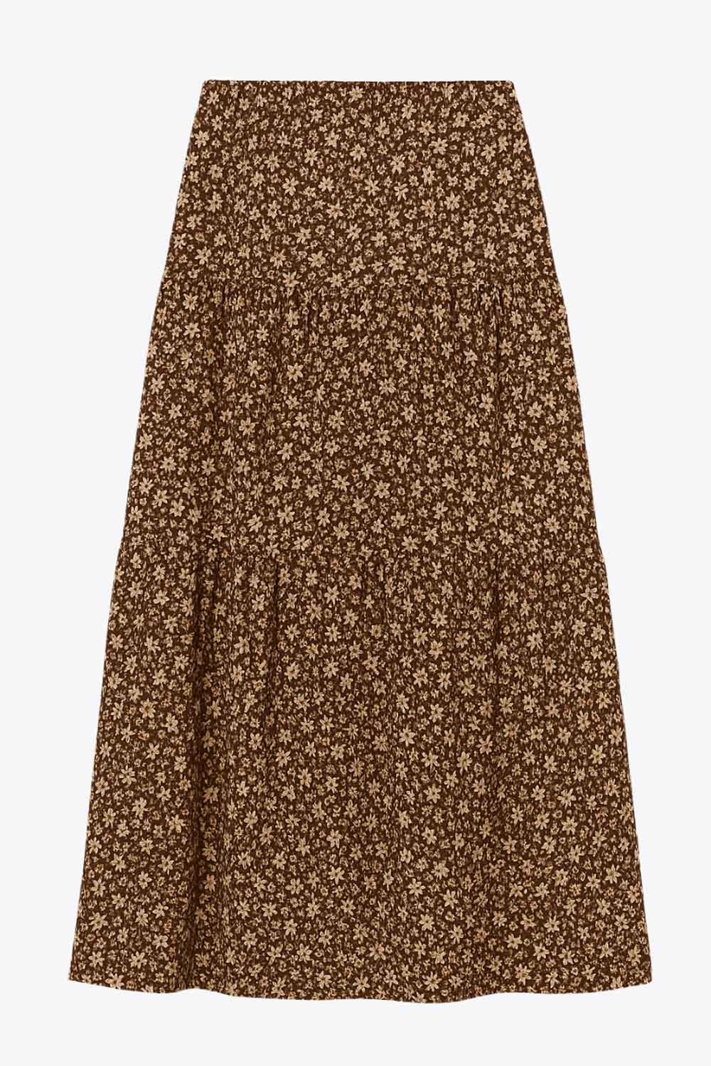 Falda midi de estampado floral, cintura alta con pretina elástica, corte en a y capas de olanes en bajo.
