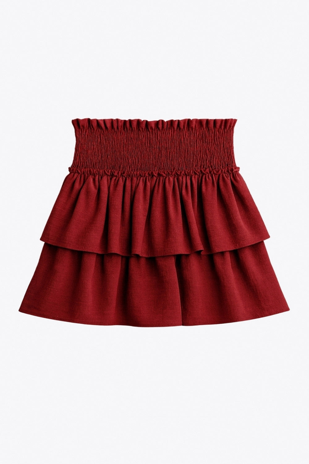 Falda short de corte en a, cintura alta elástica con pretina fruncida y capas de olanes en bajo.