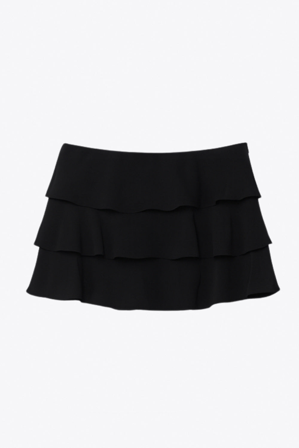 Falda short corto de cintura alta, corte en a, capas de olanes y cierre lateral con cremallera oculta.