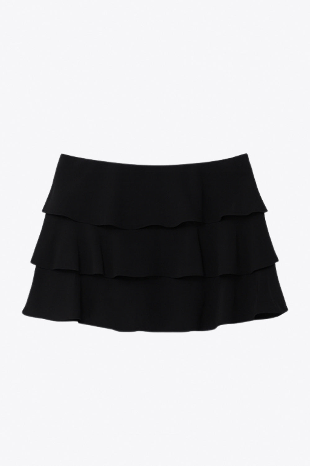 Falda short corto de cintura alta, corte en a, capas de olanes y cierre lateral con cremallera oculta.