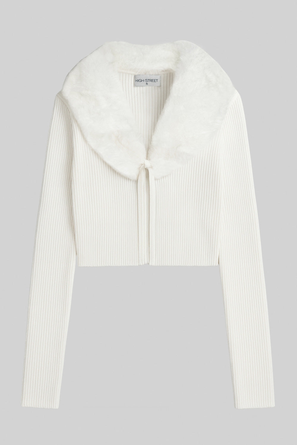 Jersey corto canalé de fit recto, manga larga, cuello v con solapa desmontable de efecto pelo y cierre frontal lazo amarrable.