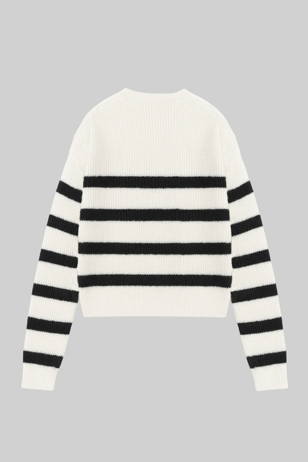 Jersey de punto, estampado rayas, fit oversized, manga larga con rib en puños y cuello redondo.