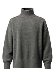 Jersey de punto, fit oversized, cuello alto con rib, manga larga amplia con hombro caído, rib en bajo y puños. Detalle de costuras decorativas.