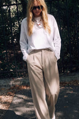 High-waisted wide-leg pleated trousers