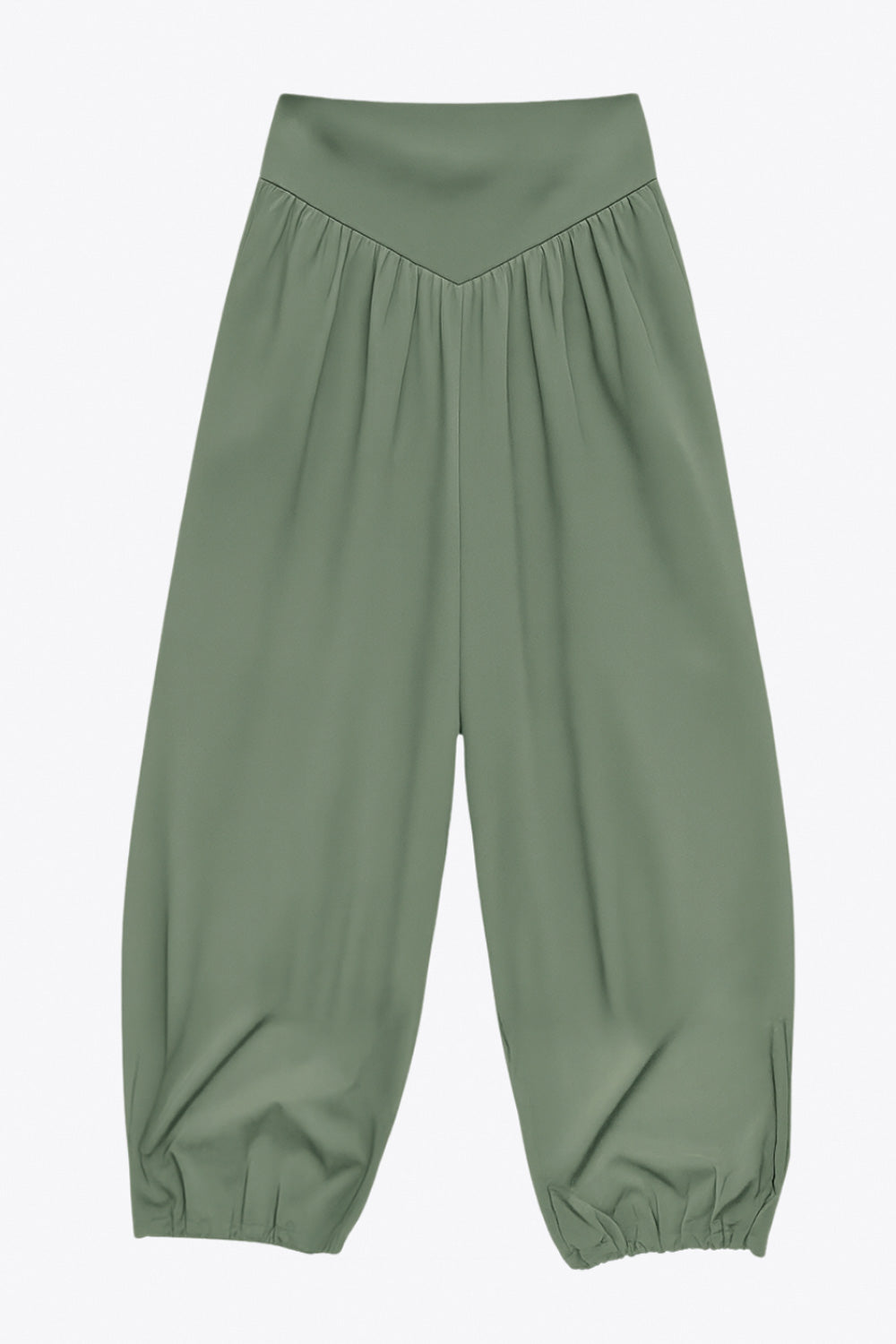 Pantalón de fit harem, cintura alta, peto con corte v frontal y plisado decorativos, rib elástico en bajo y cierre lateral con cremallera oculta.