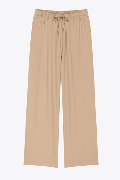 Pantalón fluido de lino, fit recto, bolsillos delanteros, cintura media con pretina elástica y jareta frontal ajustable.