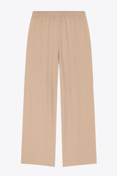 Pantalón fluido de lino, fit recto, bolsillos delanteros, cintura media con pretina elástica y jareta frontal ajustable.