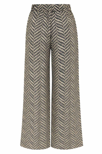 Pantalón estampado de fit fluido, bolsillos delanteros y cintura alta elástica con jareta frontal ajustable.