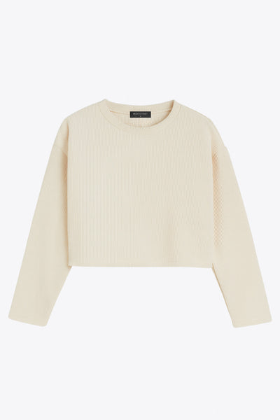 Jersey básico de punto, fit recto, cuello redondo y manga larga de hombro caído.