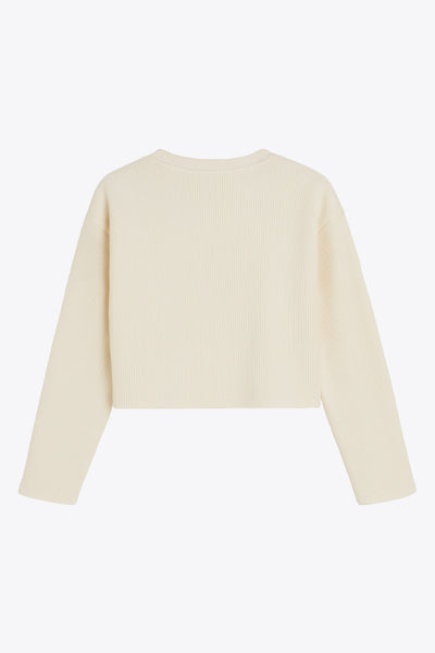 Jersey básico de punto, fit recto, cuello redondo y manga larga de hombro caído.