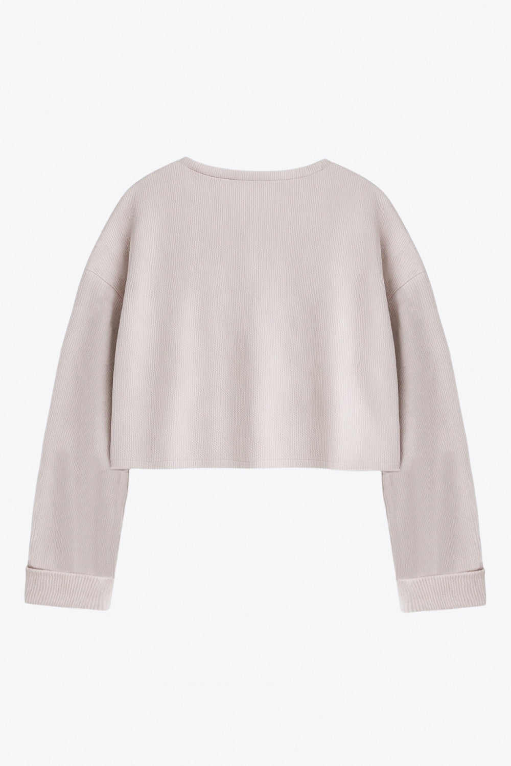 Jersey básico de punto, fit recto, cuello redondo, manga larga de hombro caído y rib en puños.