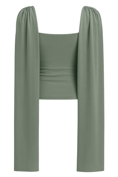 Top de fit ajustado, sin mangas, cuello redondo y detalle decorativo frontal con plisados en hombros.