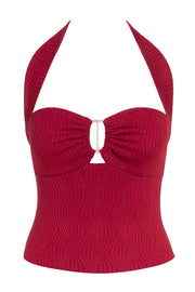 Top de fit ajustado, cuello halter con nudo amarrable posterior, escote corazón con cortes, plisados decorativos y cut out frontal. Detalle de textura en tejido.