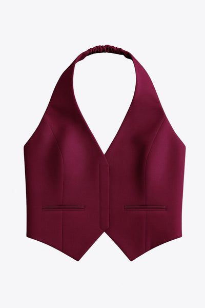 Chaleco corto cuello halter de fit ajustado, escote v, cierre lateral con cremallera oculta, vivos decorativos frontales y bajo v frontal. Escote en espalda y rib elástico posterior.