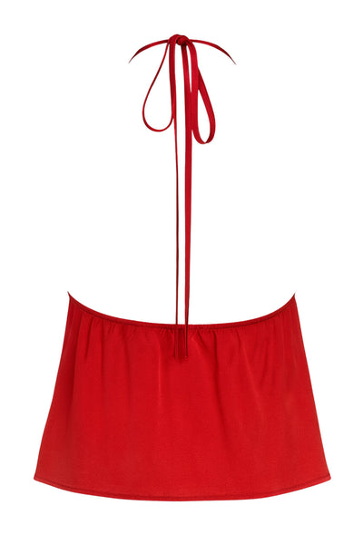 Top corto satinado de escote v con lazo amarrable frontal, rib elástico en espalda, tirantes halter con lazo amarrable posterior y abertura frontal en bajo. Detalle de peplum olanes en bajo.